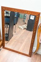 Full view of the rectangular beveled mirror with hand-painted wooden frame showing lion motif and overall condition.