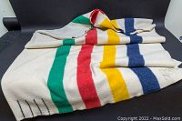 Blanket draped to show full width and stripe pattern.