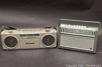 Pioneer SK-210 boombox and Phillips shortwave radio side by side on dark background.