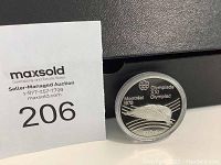 Photo showing the front side of the coin with Montreal Olympics 1976 logo and denomination 10 Dollars.