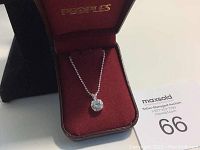 925 silver necklace with clear round-cut stone pendant displayed in a red velvet jewelry box labeled 'PEOPLE'S'.