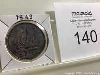 Front side of the 1949 Canadian Silver Dollar showing the 'Bluenose' schooner with 'CANADA DOLLAR 1949' inscriptions, housed in a white holder.