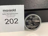 Front side of the coin showing Montreal 1976 Olympic skier design, 10 Dollar denomination.
