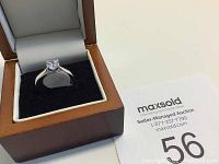 Estate silver ring marked 925 size 7 with clear stone displayed in open box