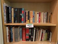 Top shelf books including titles on history, novels, biblical studies and miscellaneous topics.