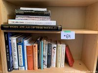 Books arranged on shelves showing titles and condition.