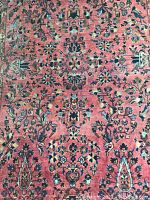 Close-up of central field showing rose-red background with slate blue and black floral motifs