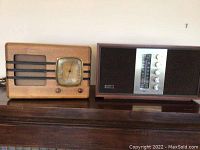 Both radios side by side on surface, front view