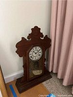 Full front view of clock upright on floor