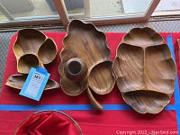 Set of three wooden platters including one Blair Hawaii, showing overall view of all pieces.