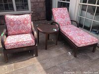 Full front view of the three-piece set with table, armchair and chaise lounge