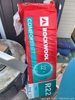 Rockwool Comfortbatt R22 insulation batts in red packaging showing the brand and R-value.