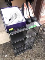 Photo showing two pairs of ladies heels on and next to a modular shoe organizer rack
