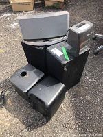 Photo of all audio equipment including Pyramid radio, two large floor speakers, two smaller speakers, and iPod station device placed outside on ground.