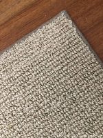 Close-up of corner showing edge binding and wool pile loops