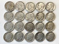 Top view of 20 Roosevelt silver dimes arranged in four rows, showing obverse side with President Roosevelt's profile and various dates.