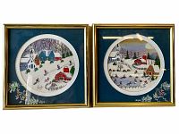 Front view of both framed folk art prints showing winter village scenes with skiers and ice skaters