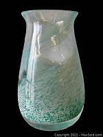 Front view of the mid century clear glass vase with green speckled design, showing the flared rim and smooth body.