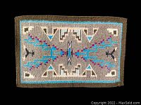 Front view of Native American hand woven wall hanging showing full pattern and colors