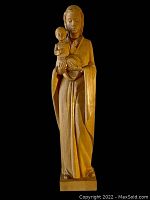 Front view of the carved wooden Madonna and Child statue showing full figure and details.