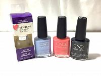 Photo showing all four bottles: Revlon Quick Dry Top Coat in box, three CND Vinylux nail polishes in three colors (light blue, coral pink, black).