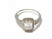 Front close-up view of the Swarovski ring showing the emerald cut center stone surrounded by halo smaller stones and stones on the band.