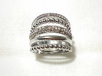 Close-up of the multi layered silver rhodium plated ring showing alternating rows of Swarovski crystals and silver beads.