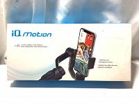 White retail box showing iQ Motion 3 Axis Gimbal Stabilizer holding a smartphone on the front with branding and product info.