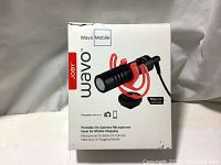 Front view of the white retail box for the Joby Wavo Mobile microphone showing product image and branding.