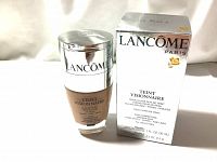 Lancôme Teint Visionnaire correcting foundation bottle and original box showing front label and branding.