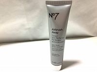 Full front view of the silver tube labeled N°7 Airbrush Away Tinted Skin Perfector, indicating 40ml content and usage info.