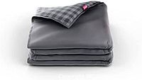 Folded grey weighted blanket showing dual-sided fabric with solid dark grey one side and grey plaid checkered pattern on other side.