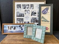 Group of five frames and wall art pieces displayed on a dark surface: Two green ceramic 3.5x5 photo frames, one 20x20 multi-opening photo frame, framed Warren Kimble signed cow picture, vegetable triptych in vertical frame.