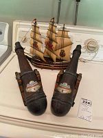 Photo of two vintage Mirafiore Chianti Classico canon decanters with 1966 labels and ship lamp behind them, sitting on washing machine.