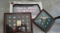 Three jointly framed NHL and Olympic hockey pin collections with wood and black frames, featuring team logos, jersey pins, and small badges.