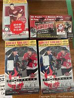 Four sealed hockey card boxes: two Fleer Hot Prospects 2007-08, one O-Pee-Chee 2008-09, one Upper Deck Victory 2009-10