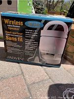 Front view of the Advent wireless indoor/outdoor speaker in original box showing product features and wireless 900 MHz technology.