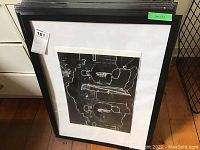 Stack of Ikea Saxnas print frames, several still in original plastic wrap, black frames with white mats, measuring roughly 19.75 x 27.5 inches
