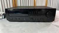 Front view of Marantz SR-48MK2U stereo receiver powered on displaying FM tuner frequency 87.5 MHz.