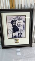 Full view of framed photograph print showing Babe Ruth and Lou Gehrig with signatures and MLB plaque.