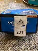 Blue box packaging of Athletic Works ankle and wrist weights, 5 lb pair, with branding and product usage images.
