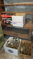 Box with assorted clear glass canning jars with metal lids, some branded Kerr