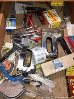 Overview of staplers, staples, and tools in drawer