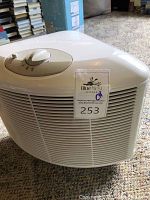White Sunbeam air purifier side view on carpet
