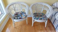 Front view of both wicker chairs with cushions