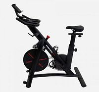 Side view of black Inspire indoor cycle showing flywheel, frame and seat adjusters