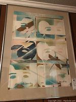 Framed original artwork showing full view of abstract multi-panel piece with soft blues, beige, and browns.