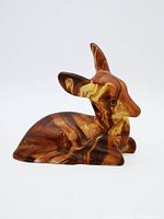 Front angled view of brown and tan marbled ceramic fawn figurine showing detailed face and ears