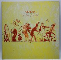Front cover of the 1976 Genesis album 'A Trick of the Tail' showing the yellow background with symbolic illustrations and band name in red.