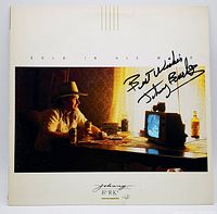 Front cover of the Johnny Burke vinyl record album "Gold in His Mind" showing the photograph and signature on the sleeve.